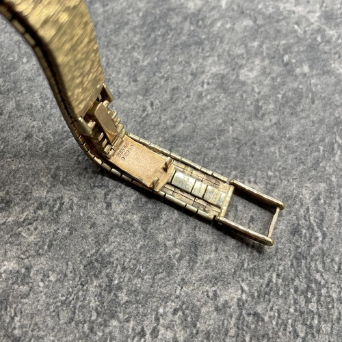6 - Omega ladies 9ct integral bracelet watch, 16mm case, cream dial with gilt hands and markers, manual ... 