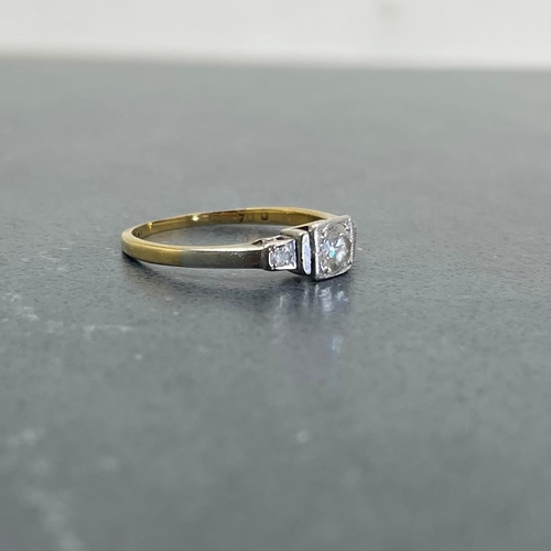 66 - 18ct and platinum diamond ring, .30ct central stone flanked by two smaller diamonds, size K, 1.8g