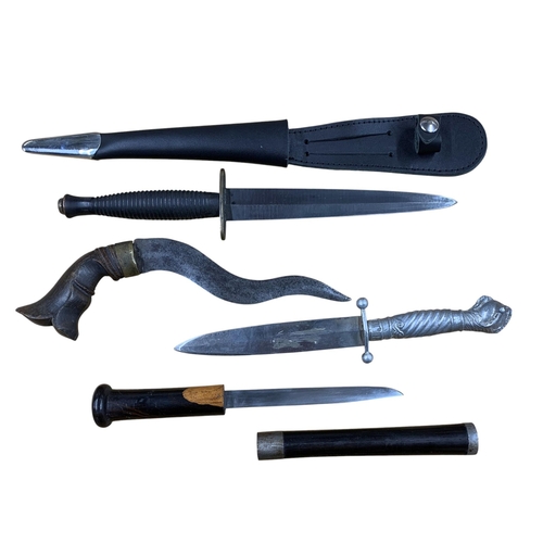 2086 - Mixed quantity of daggers and knives to include Indian curved dagger, dragon claw and ball handled s... 