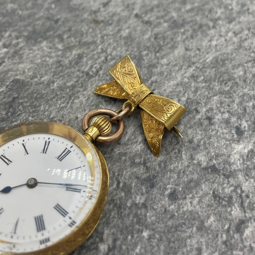 25 - 18k Swiss fob watch, 33mm case, enamel dial, with 18k bow brooch with 9ct bail, 29.3g gross