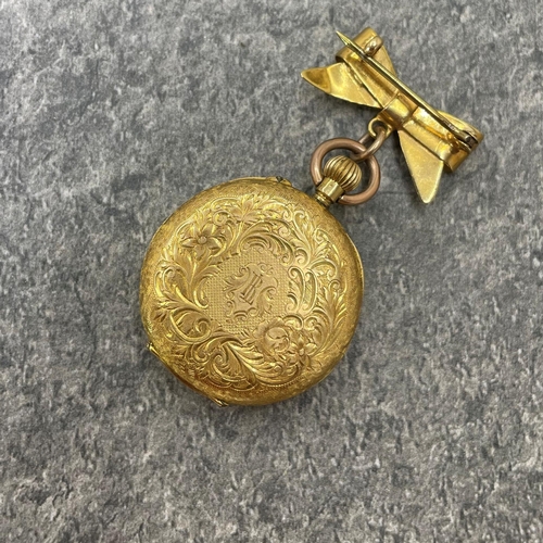 25 - 18k Swiss fob watch, 33mm case, enamel dial, with 18k bow brooch with 9ct bail, 29.3g gross