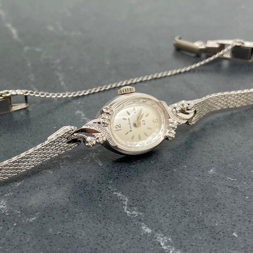4 - Bulova 14k white gold ladies cocktail watch, 16mm case with fancy diamond set bezel, silvered dial w... 