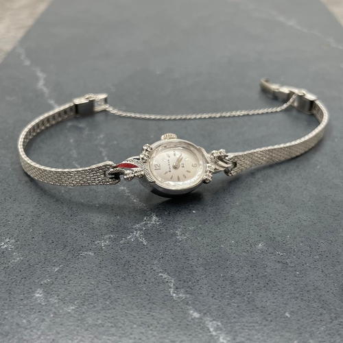 4 - Bulova 14k white gold ladies cocktail watch, 16mm case with fancy diamond set bezel, silvered dial w... 