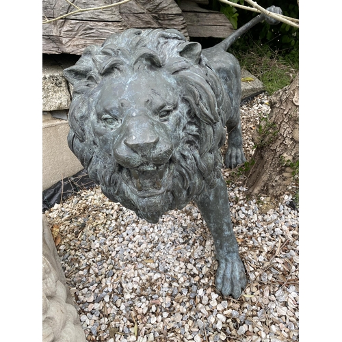 1 - Exceptional opposing pair of cast bronze standing roaring lions with well cast teeth, mane and tail,... 