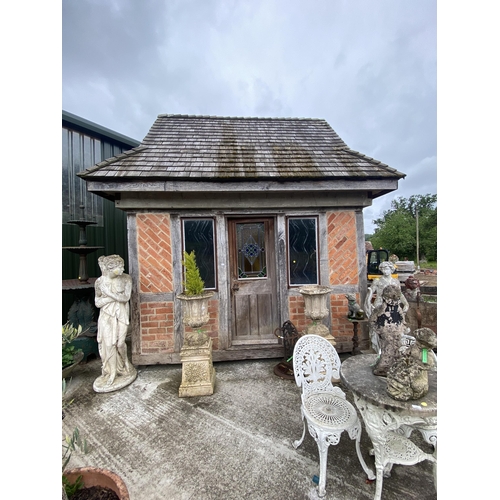 142 - Incredible two storey quaint tudor style red brick summer house, with insulated elm and oak interior...