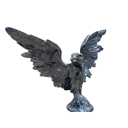 14 - Car mascot - Eagle, with spread wings, on associated mahogany plinth, 21cm high in total