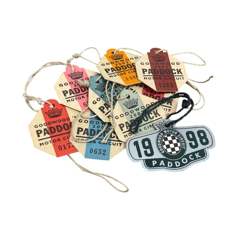 54 - Collection of Goodwood memorabilia - to include sixteen GRC badges, framed photo and signature of St... 