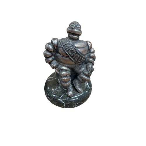 27 - Vintage Michelin bakelite ashtray, 15cm long, with a further Michelin resin ornament (2)