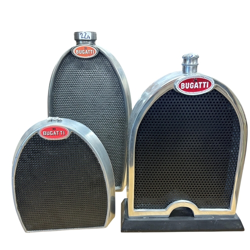 26 - Three display models of Bugatti radiators, including cast aluminium on a plinth base, 50cm high, wit... 