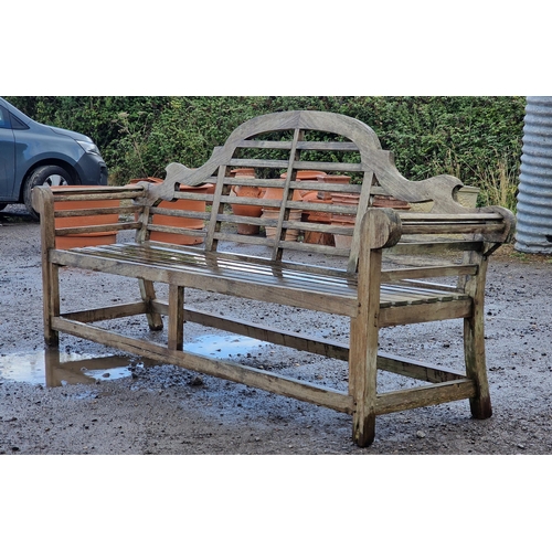 101 - Large four seat teak Lutyens style bench with cushion, H 104cm x W 225cm x D 50cm