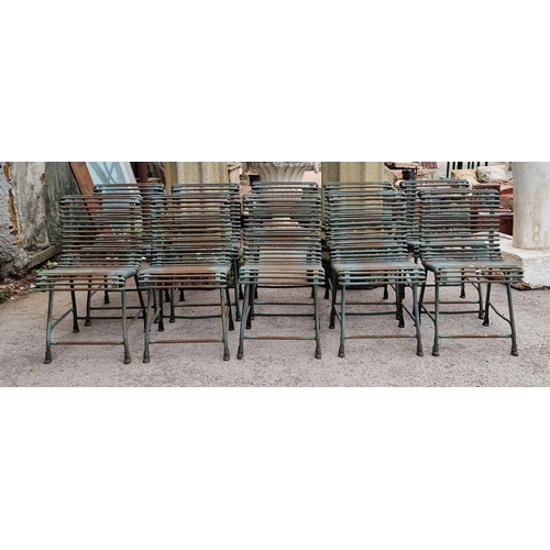 14 - Set of ten 20th century iron Arras style chairs with scrolling slatted seats and backs, raised on ho...