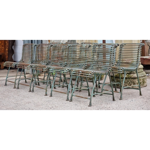 14 - Set of ten 20th century iron Arras style chairs with scrolling slatted seats and backs, raised on ho... 