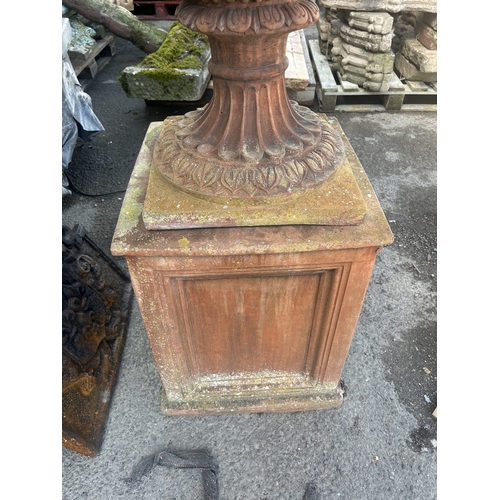 236 - Good quality pair of terracotta urns with classical maiden mask detail, floral swags and darted rims... 