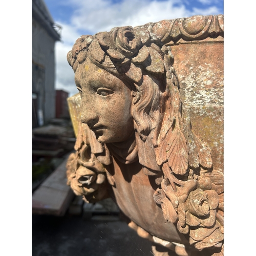 236 - Good quality pair of terracotta urns with classical maiden mask detail, floral swags and darted rims... 