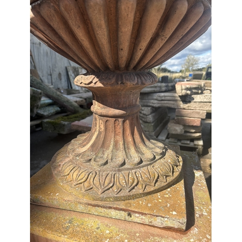 236 - Good quality pair of terracotta urns with classical maiden mask detail, floral swags and darted rims... 