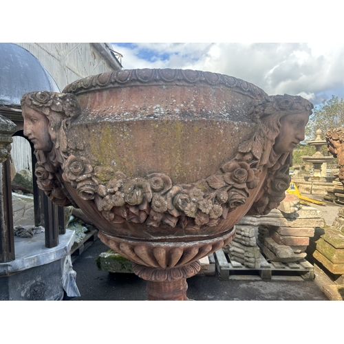 236 - Good quality pair of terracotta urns with classical maiden mask detail, floral swags and darted rims... 