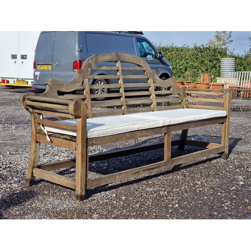 101 - Large four seat teak Lutyens style bench with cushion, H 104cm x W 225cm x D 50cm