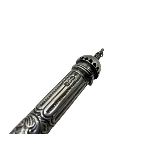 259 - An interesting silver item believed to be a Mezuzah case, the hinged top mounted by a figure and fur... 