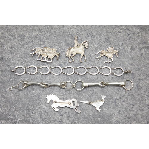 67 - A group of silver equestrian jewellery and a pheasant brooch, Comprising; a jumping pony; two race h... 