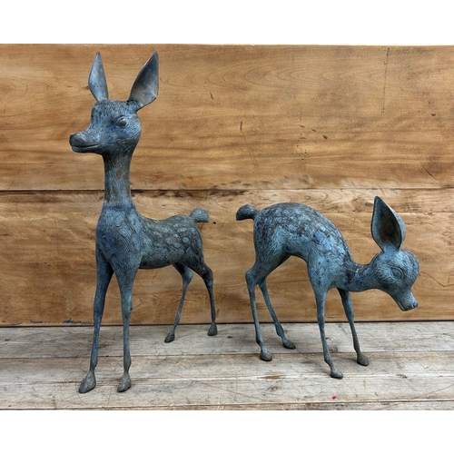 325 - Two cast bronze garden ornament sculptures of deer, largest H 55cm