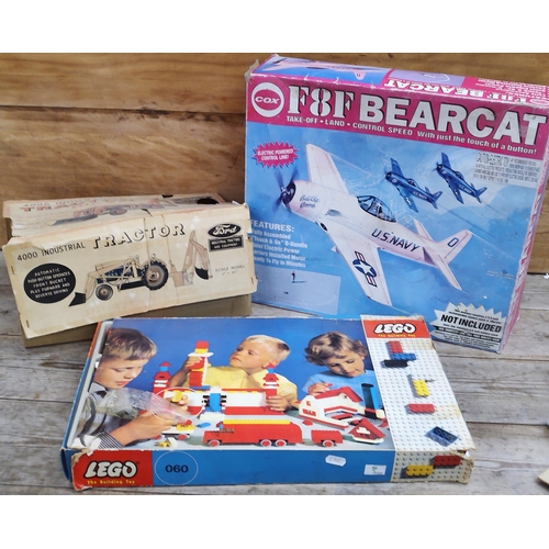 637 - Mixed quantity of vintage toys to include a Cragstan tinplate toy battery remote control Ford 4000 I... 