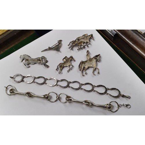 67 - A group of silver equestrian jewellery and a pheasant brooch, Comprising; a jumping pony; two race h... 