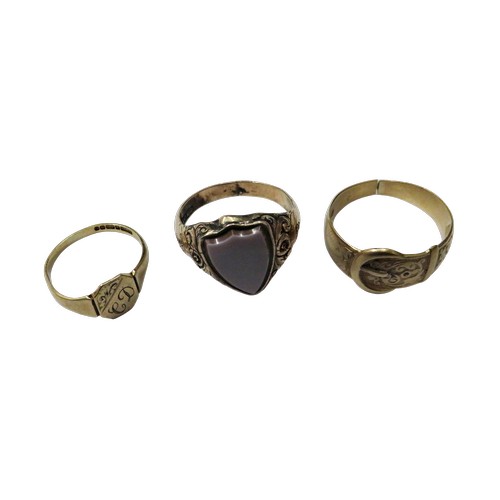 14 - A vintage 9ct gold buckle ring and two signet rings; the buckle ring with hallmarks for Birmingham 1... 