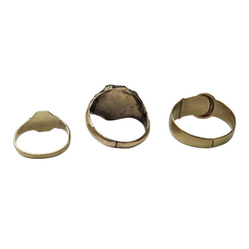 14 - A vintage 9ct gold buckle ring and two signet rings; the buckle ring with hallmarks for Birmingham 1... 
