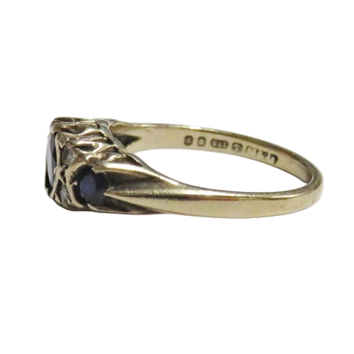 16 - A vintage 9ct gold, sapphire and diamond dress ring, the three graduated oval and round dark-blue/bl... 