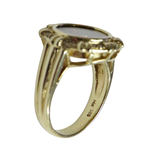 17 - A Continental multi-gem ring resembling a 'happy diamonds' glazed cluster, the shaped-round head enc... 