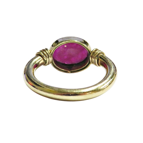 18 - A Continental fracture-filled-ruby single stone ring, the oval mixed-cut opaque stone approx. 10mm x... 