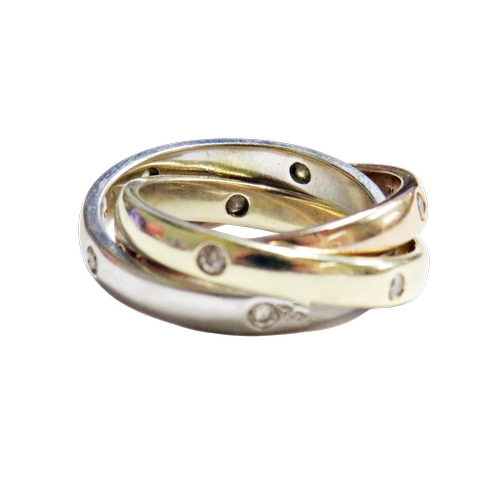 20 - A 9ct tri-colour gold and diamond 'Constellation' trilogy ring, each band inset with five small roun... 