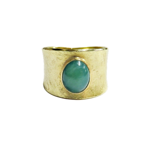 22 - A 1970's modernist chrysoprase single stone broad-band ring, the oval cabochon rub-over set within a... 