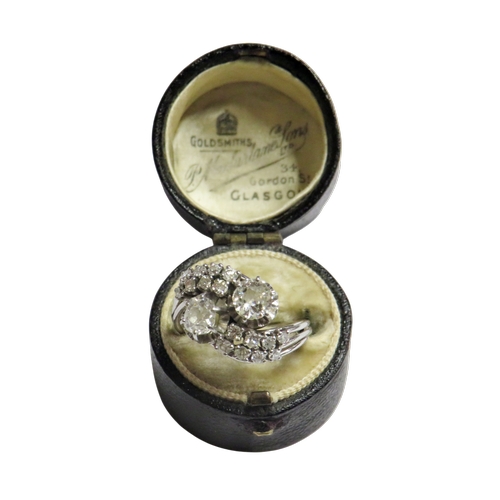 27 - A mid 20th century Continental diamond cross-over ring, possibly French, the two principle old-cut s... 