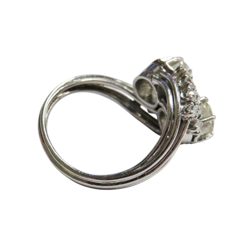 27 - A mid 20th century Continental diamond cross-over ring, possibly French, the two principle old-cut s... 