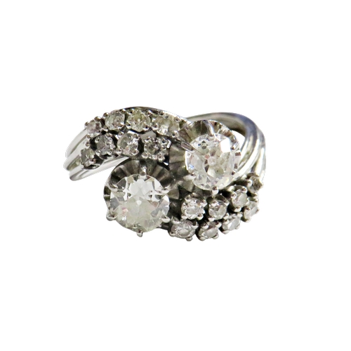 27 - A mid 20th century Continental diamond cross-over ring, possibly French, the two principle old-cut s... 