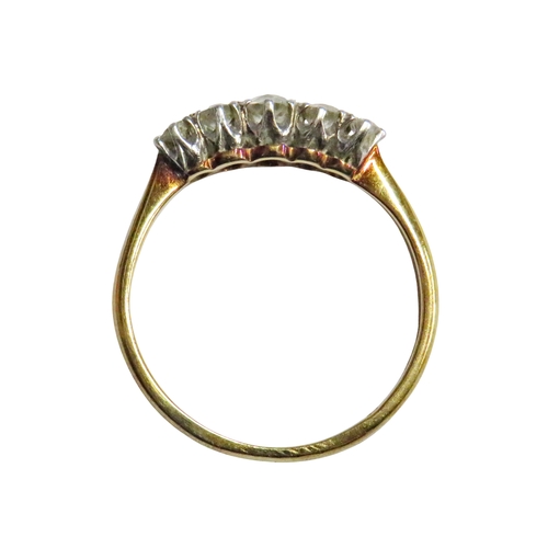 29 - A mid-20th century gold and diamond five stone ring, the graduated old-cut and early round brilliant... 