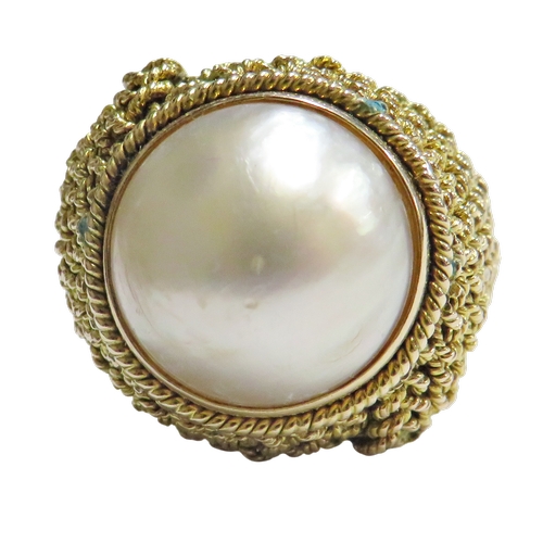31 - A vintage Continental gold and mabe-pearl ring probably American, the mabe pearl approx. 15.5mm diam... 