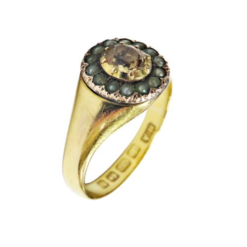32 - A Victorian topaz and half-pearl oval cluster later mounted in a 22ct gold signet-type ring, the cen... 