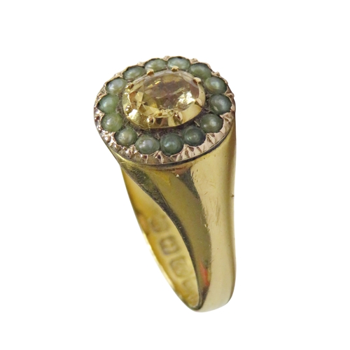32 - A Victorian topaz and half-pearl oval cluster later mounted in a 22ct gold signet-type ring, the cen... 