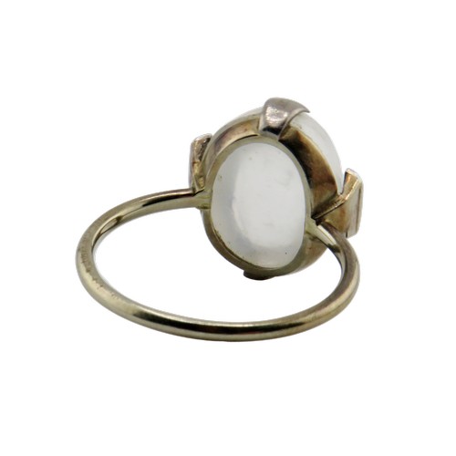 37 - A mid-20th century platinum, moonstone and tiny diamond ring, the oval moonstone measures approx. 13... 