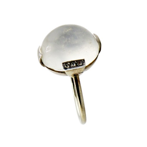 37 - A mid-20th century platinum, moonstone and tiny diamond ring, the oval moonstone measures approx. 13... 