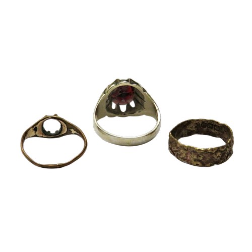 38 - Four various rings comprising, a silver and oval garnet single stone gypsy ring, size S+; a floral-t... 