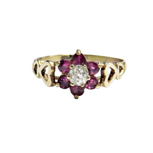 40 - A vintage ruby and diamond cluster ring, centred with a small old-cut diamond approx. 0.15cts, withi... 