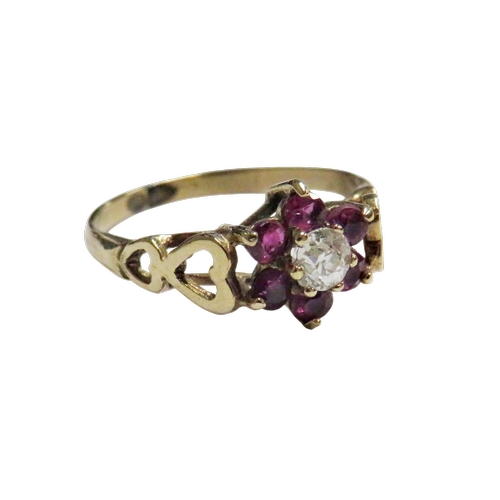 40 - A vintage ruby and diamond cluster ring, centred with a small old-cut diamond approx. 0.15cts, withi... 