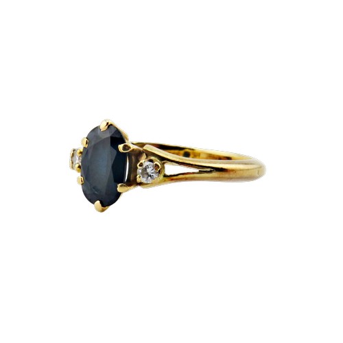 41 - A vintage French gold, sapphire and diamond three stone ring, centred with a very dark blue/black ov... 
