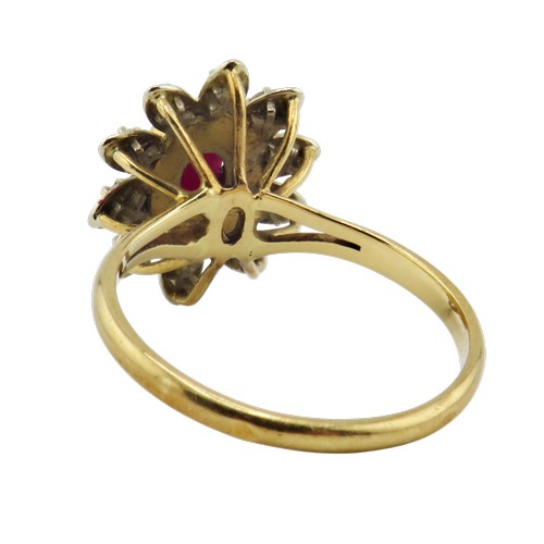 42 - A vintage French gold, ruby and diamond oval flower-head cluster ring, centred with an oval mixed-cu... 