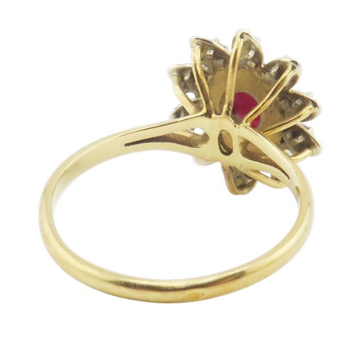 42 - A vintage French gold, ruby and diamond oval flower-head cluster ring, centred with an oval mixed-cu... 