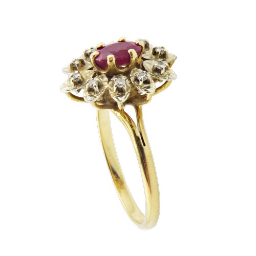 42 - A vintage French gold, ruby and diamond oval flower-head cluster ring, centred with an oval mixed-cu... 
