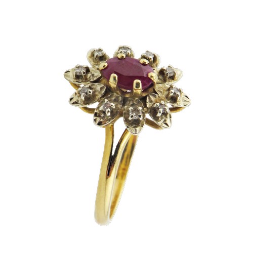42 - A vintage French gold, ruby and diamond oval flower-head cluster ring, centred with an oval mixed-cu... 